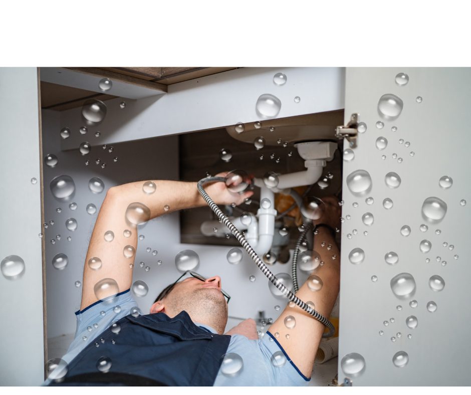 person repairing a leak under the sink